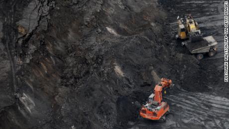 A large excavator loads an oil sands truck at the Suncor mine in Alberta in 2009.