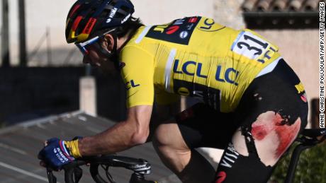 Slovenia&#39;s Roglic wearing the overall leader&#39;s yellow jersey rides after falling during the eighth stage of the Paris-Nice race.