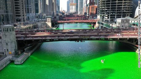 The city surprised residents by dying the river green after initially canceling the St. Patrick&#39;s Day tradition because of Covid-19.