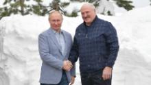 Russian President Vladimir Putin, left, shakes hands with Belarus President Alexander Lukashenko in Sochi on February 22.