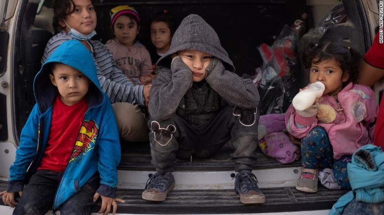 Migrant children from Central America sit in the back of a US Border Patrol vehicle as they wait to be transported on March 14. They had just crossed the Rio Grande on a raft, traveling from Mexico into Penitas, Texas. Pictured in the front row are Yoandri, 4; Michael, 5; and Yojanlee, 2, all from Honduras.