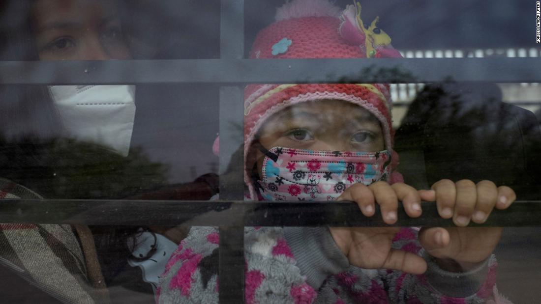 Yaretsi, a 4-year-old from Honduras, sits on the lap of her mother, Angie, while looking out the window of a US Border Patrol vehicle on March 15. They had just crossed the Rio Grande on a raft.