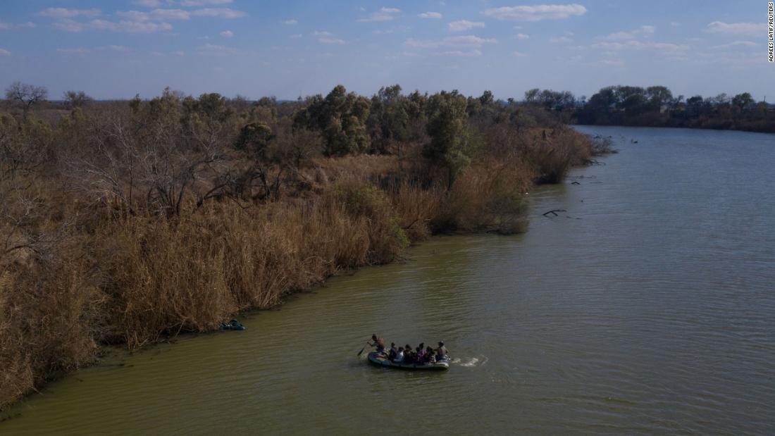 Smugglers use a raft to transport migrant families and children across the Rio Grande into Texas on March 6.