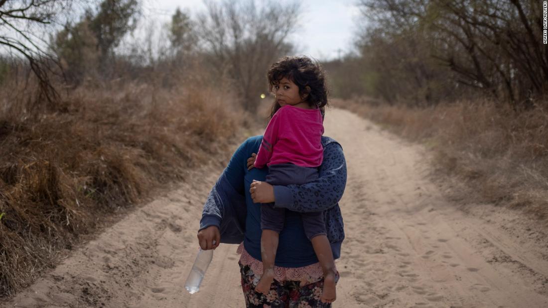 Maria, a 4-year-old from El Salvador, is held by her mother, Loudi, after they crossed the Rio Grande on March 5.