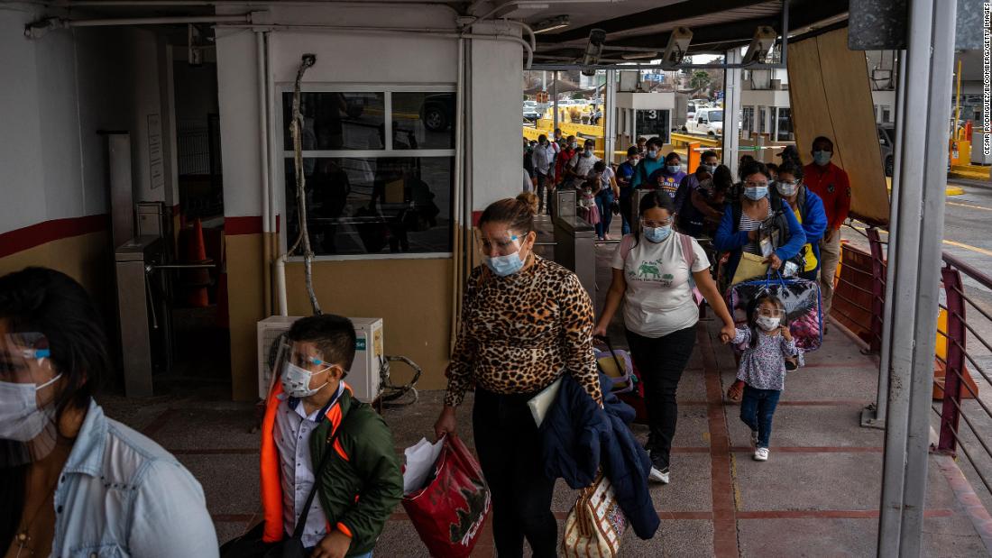 Migrants from the Matamoros camp in Mexico arrive to cross the border bridge into the United States on Febuary 26. The camp recently emptied out after the Biden administration ended the Trump administration&#39;s Migrant Protection Protocols, which forced many to wait in Mexico while their immigration cases made their way through US courts.