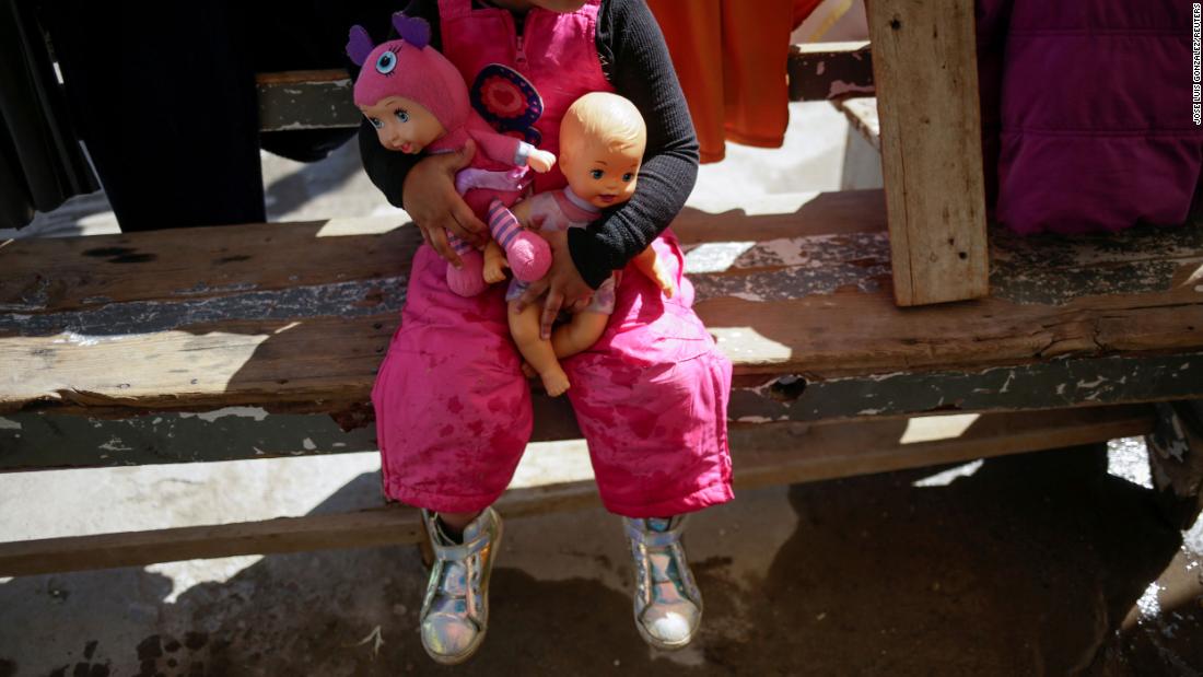 A migrant girl from Brazil who&#39;s seeking asylum in the United States sits on a bench inside a shelter in Ciudad Juarez, Mexico, on February 19.