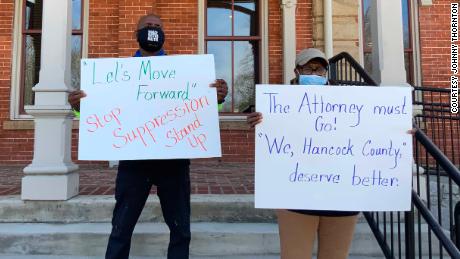 Charles Jackson, left, and Barbara Reynolds protest last week at the county courthouse in Sparta.