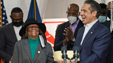 Cuomo presents Hazel Dukes, president of the New York State chapter of the NAACP, a cake to celebrate her birthday.