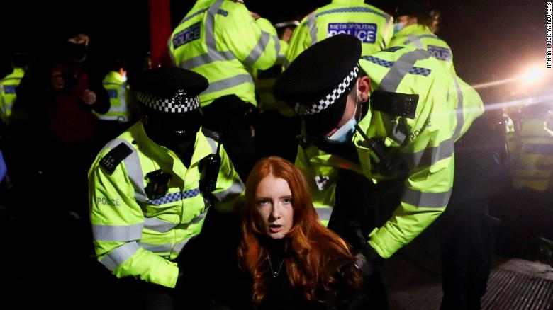 Police detain Patsy Stevenson on March 13 as people gathered at a peaceful memorial in London following the murder of Sarah Everard. Those scenes led to criticism of the police and increased scrutiny of the pending crime bill.