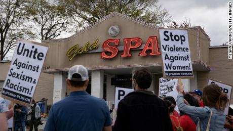 Activists demonstrate outside Gold Spa, the scene of one of the shootings, on March 18, 2021.