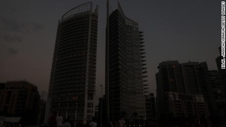 Buildings loom in darkness during a blackout in Beirut on July 5, 2020. 