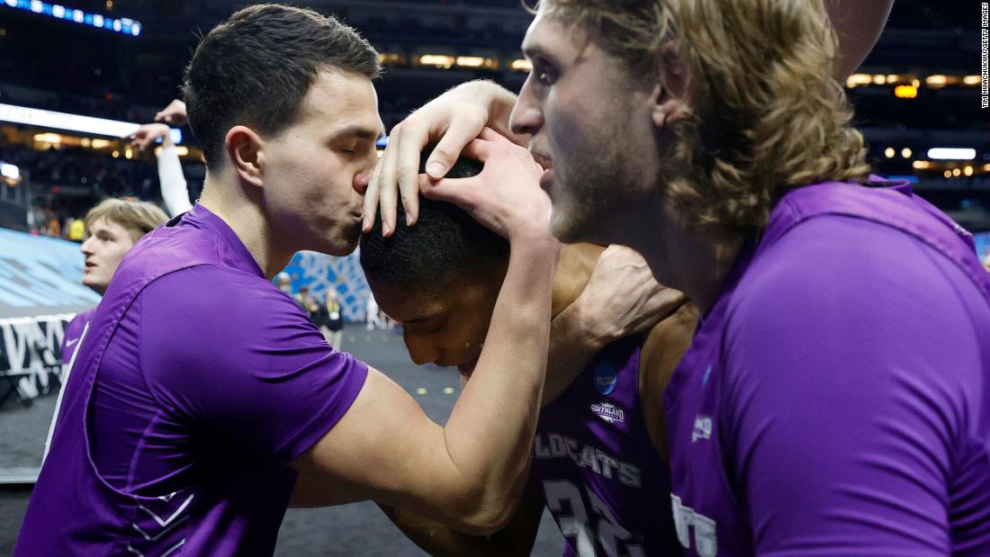 Tobias Cameron kisses the head of teammate Joe Pleasant after Pleasant&#39;s two clutch free throws gave Abilene Christian a 53-52 win over Texas on March 20. It was the last of several first-round upsets in this NCAA Tournament. Abilene Christian was a 14-seed. Texas was a 3-seed.