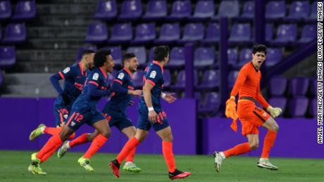 Yassine Bounou wheels away in celebration after scoring Sevilla&#39;s equalizer