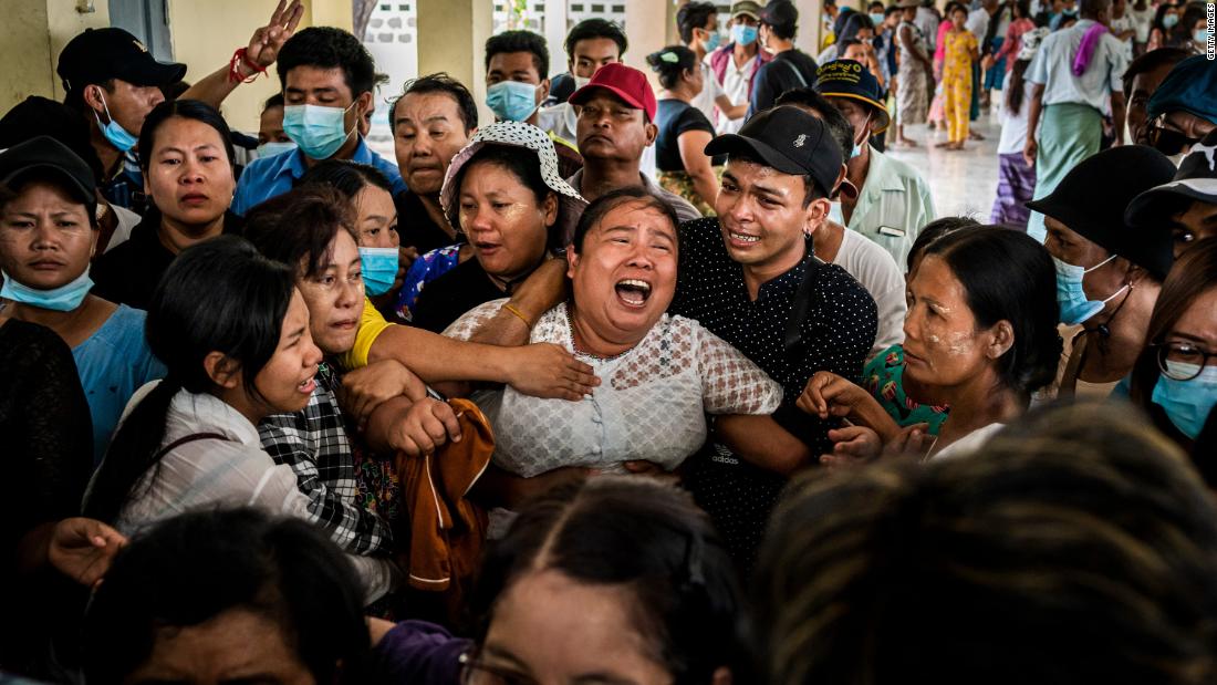 The mother of Aung Kaung Htet wails during the teenage boy&#39;s funeral on Sunday, March 21. Aung, 15, was killed when military junta forces opened fire on anti-coup protesters in Yangon, Myanmar.