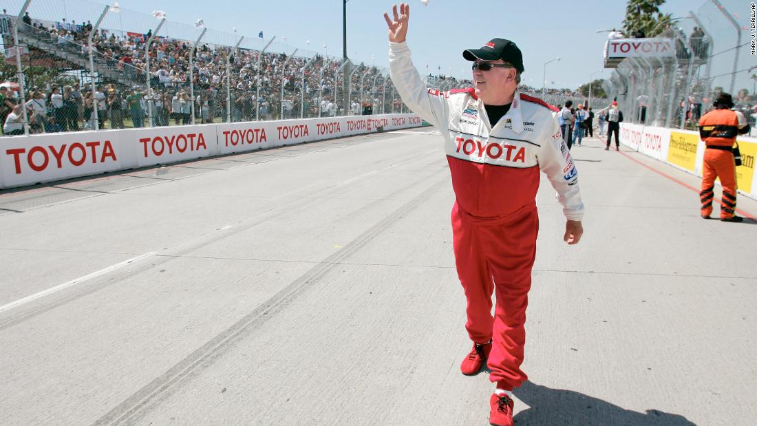 Shatner waves to the crowd prior to a celebrity race at the Grand Prix of Long Beach in 2006.