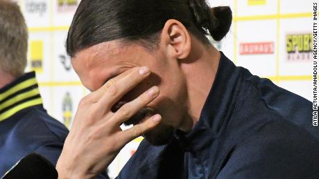 Ibrahimovic cries during a press conference.
