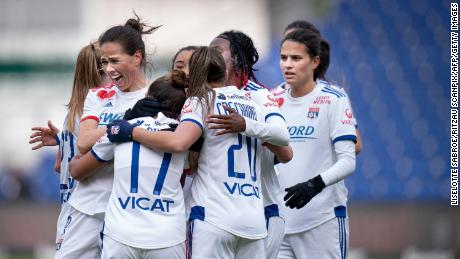 Lyon players celebrate scoring against Broendby IF in the Women&#39;s Champions League. 