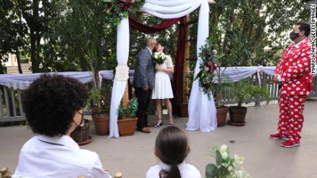A couple get married at an outdoor wedding on Valentine's Day 2021 in Long Beach, California.