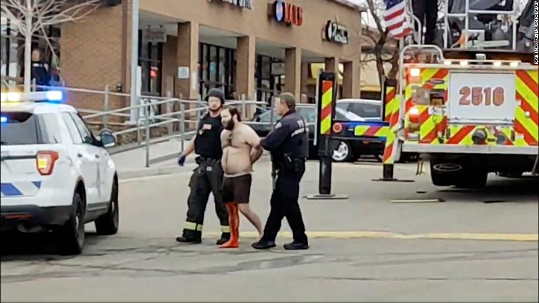 Police lead a handcuffed man, bleeding from his leg and dressed only in underwear, away from the scene of the shooting on Monday. The handcuffed man is shooting suspect Ahmad Al Aliwi Alissa, &lt;a href=&quot;https://www.cnn.com/us/live-news/boulder-colorado-shooting-3-23-21/h_4b8ba302da2648a8ab2f2640ae52a0f8&quot; target=&quot;_blank&quot;&gt;his brother confirmed to CNN.&lt;/a&gt; Alissa, 21, is a resident of Arvada, Colorado, a suburb of Denver.
