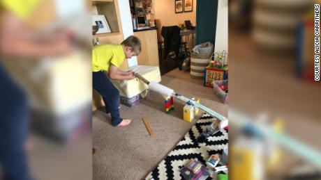 Alicia Carrithers&#39; son Gavin, 10, creating a marble run for a school project at home.