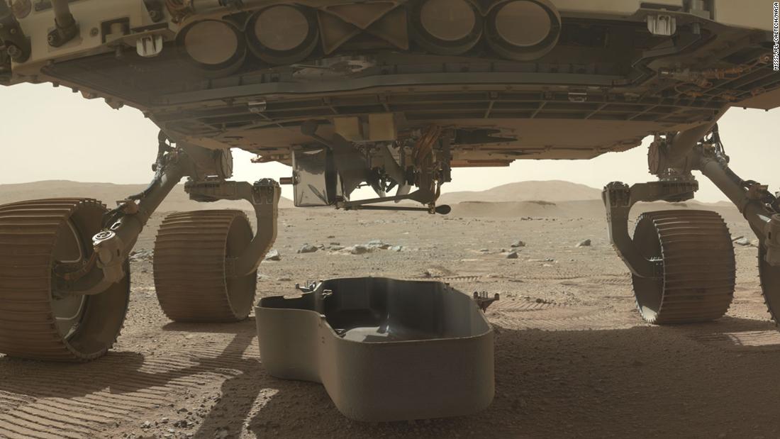 This image shows a debris shield, which protected the Ingenuity helicopter during landing. The helicopter can still be seen attached underneath the rover.