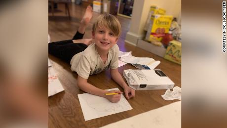 Coomber&#39;s son Gus, now in first grade, doing his school work at home.