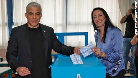 Israel&#39;s centrist former television anchor Yair Lapid and his wife Lihi cast their votes in March&#39;s election.