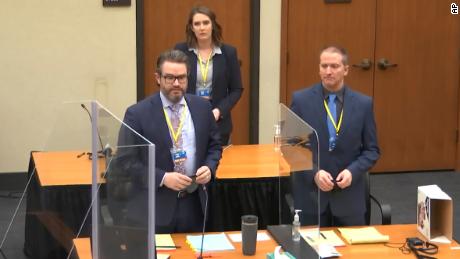 In this image taken from video, defense attorney Eric Nelson, left, former Minneapolis police officer Derek Chauvin, right, and Nelson&#39;s assistant Amy Voss, back, introduce themselves to jurors on Monday, March 22, 2021, at the Hennepin County Courthouse in Minneapolis.