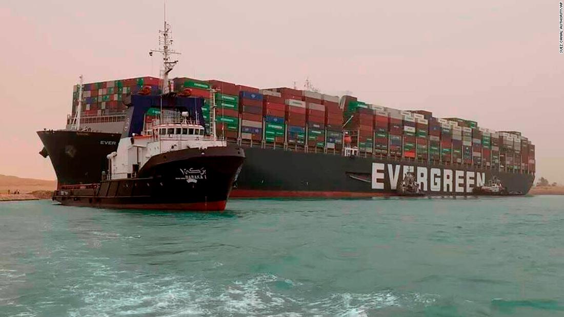 Tugs resume effort to clear Suez Canal container ship blockage as traffic jam builds