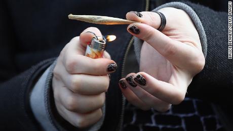A marijuana smoker holds a joint in Brooklyn, New York, in April 2020.
