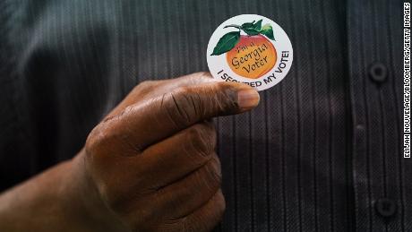 Corporate giants bow to pressure in Georgia voting law backlash
