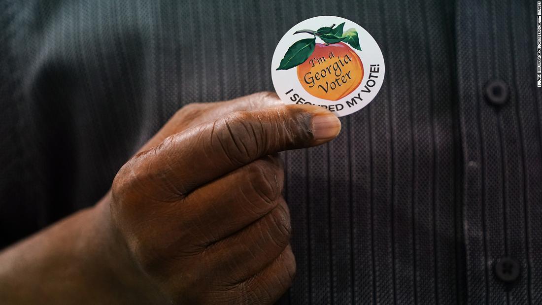 Corporate giants bow to pressure in Georgia voting law backlash