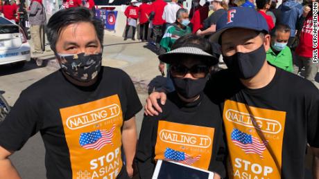 From left, Ted Nguyen, Kien Nguyen and Tam Nguyen rally to stop anti-Asian violence in Los Angeles on Saturday, March 27, 2021.