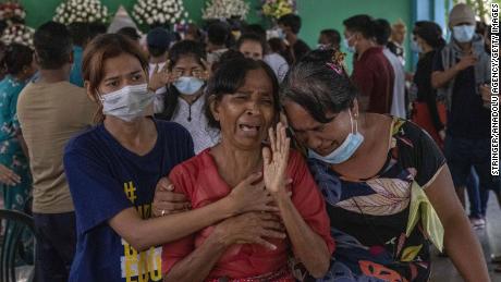 Family members and relatives attend the funeral ceremony of 13 year-old Sai Wai Yan, who was shot dead while playing outside his house in Yangon, Myanmar on March 28.