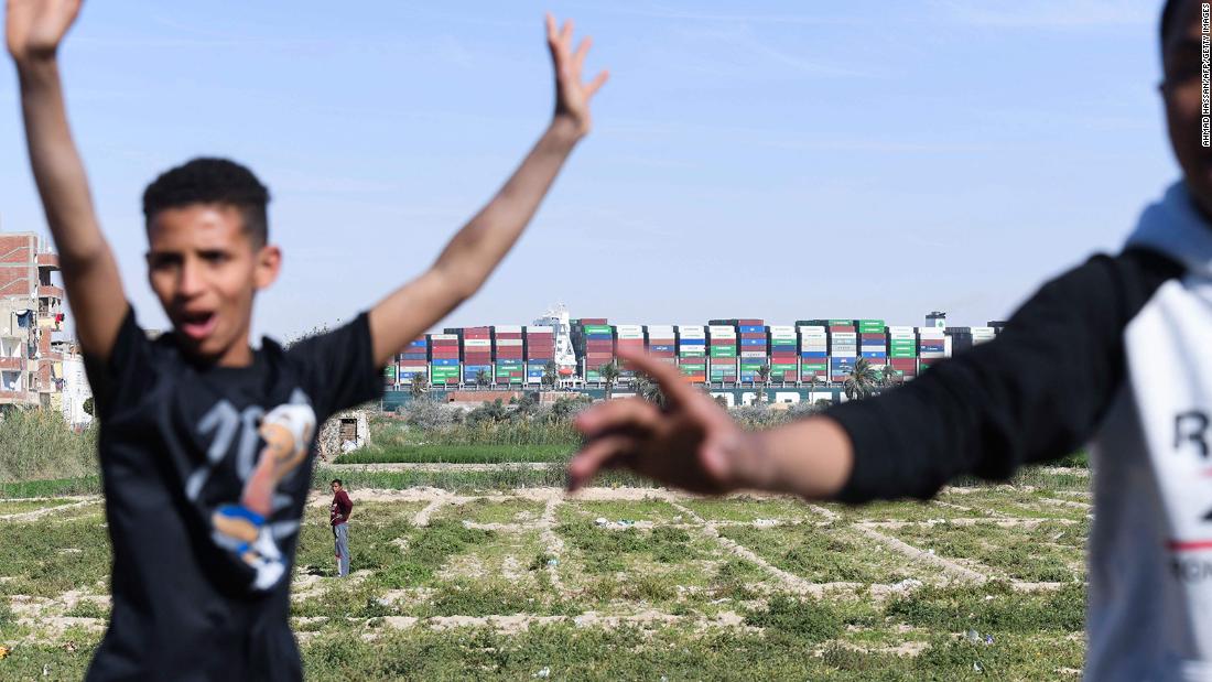 Children celebrate after the Ever Given container ship was freed in the Suez Canal on Monday, March 29.