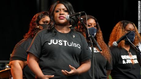 Tiffany Crutcher, the sister of Terence Crutcher, is pictured on stage with family members during events to mark Juneteenth. 