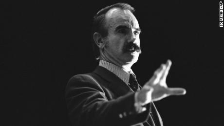 Convicted Watergate conspirator G. Gordon Liddy gestures as he speaks to a capacity audience at Xavier University, Dec. 11, 1980, in Cincinnati. A small group of students demonstrated outside the auditorium prior to Liddy&#39;s speech, protesting the use of student funds to pay for his appearance.