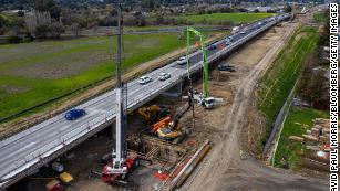 Contractors work on a portion of Highway 101 in Petaluma, California, on March 22. Improving roads and bridges is a key part of Biden&apos;s infrastructure plan.