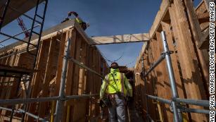 A construction worker walks through an affordable housing project in Oakland, California, in 2019. Biden&apos;s plan would invest in affordable housing.