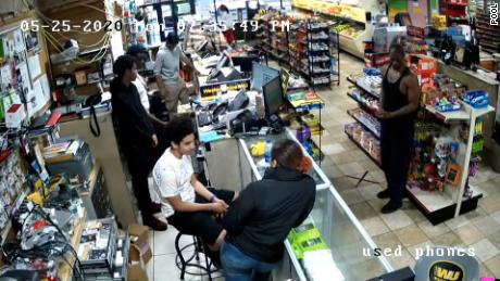 George Floyd, right, is seen in surveillance video inside Cup Foods on May 25, 2020.