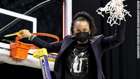 South Carolina head coach Dawn Staley celebrates after cutting the last piece of the net during the Elite Eight round of the NCAA Women&#39;s Basketball Tournament.