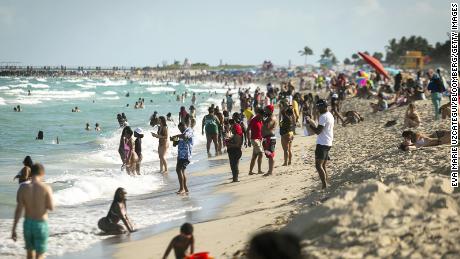 People gather in the South Beach neighborhood in Florida on Saturday, March 27, 2021.