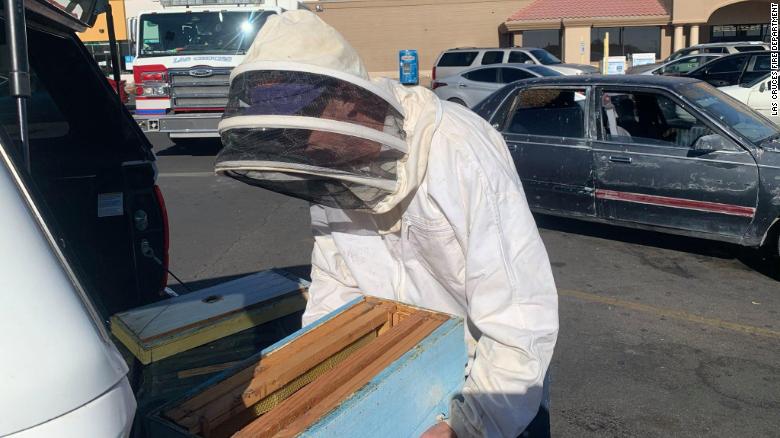 A man returned from shopping and found 15,000 bees in his car 210401150629-02-firefighter-saves-bee-swarm-exlarge-169