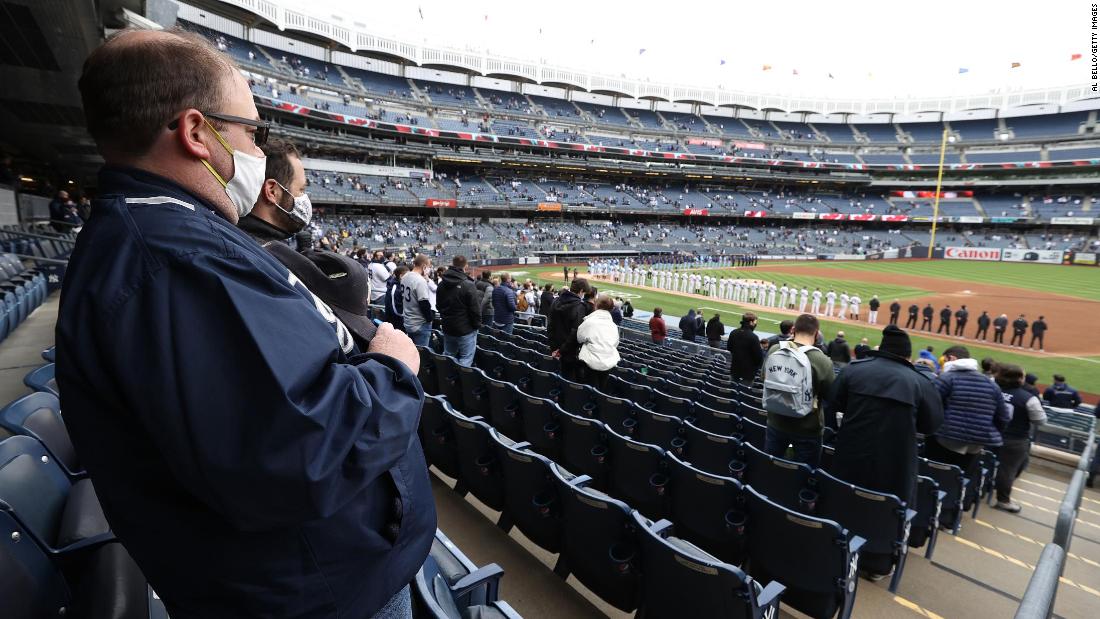 Fans stand for the National Anthem at the New York Yankees&#39; home opener on Thursday, April 1.