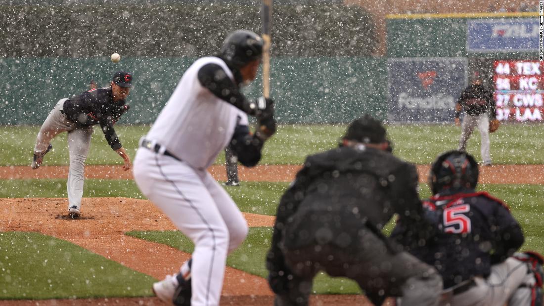 Cleveland&#39;s Shane Bieber throws a first-inning pitch to Detroit&#39;s Miguel Cabrera, who homered to right field. The game in Detroit started with snow flurries.