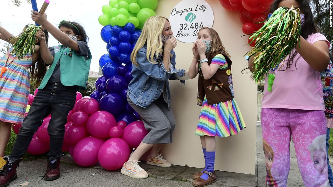 An 8-year-old cancer survivor sold over 30,000 boxes of Girl Scouts cookies. She's using proceeds to help 'fellow childhood cancer warriors'