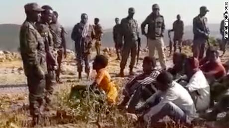 Footage obtained by CNN shows soldiers rounding up dozens of young men on a clifftop and checking if they&#39;re armed. 