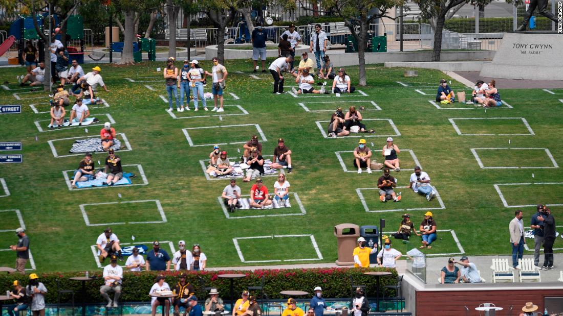 Fans sit in socially distanced squares during a game in San Diego.