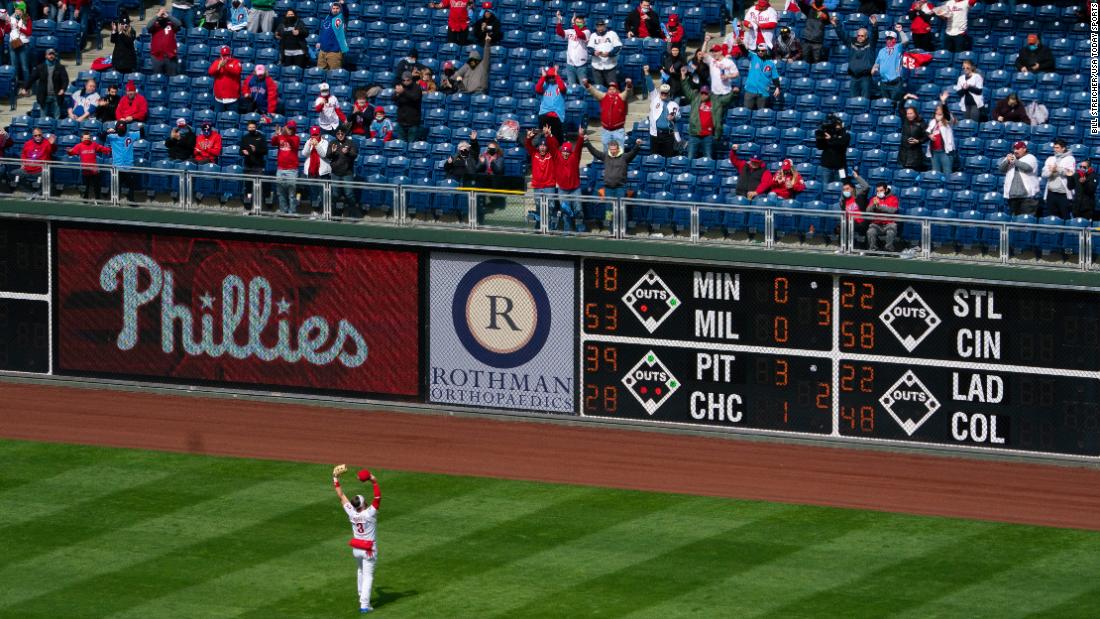 Phillies star Bryce Harper waves to fans before the start of the first inning.