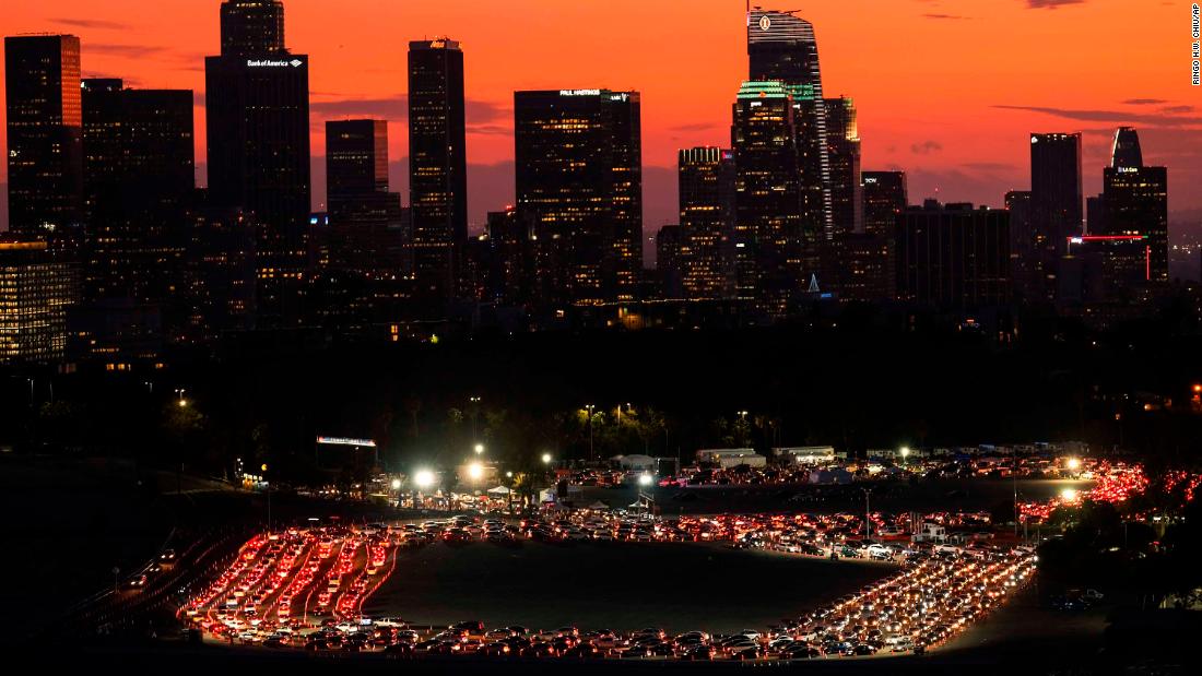 Motorists wait in lines for Covid-19 tests outside of Los Angeles&#39; Dodger Stadium on January 4. 